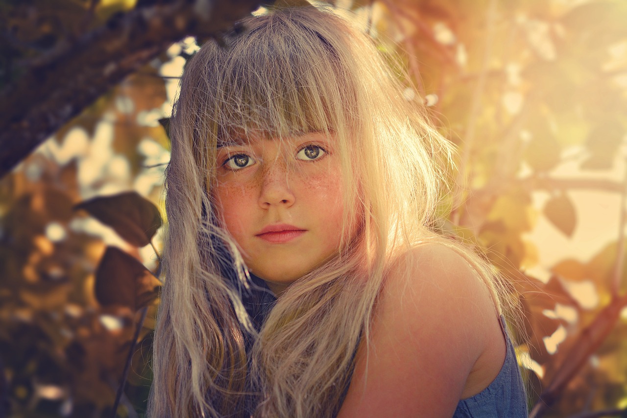 girl playing in a tree